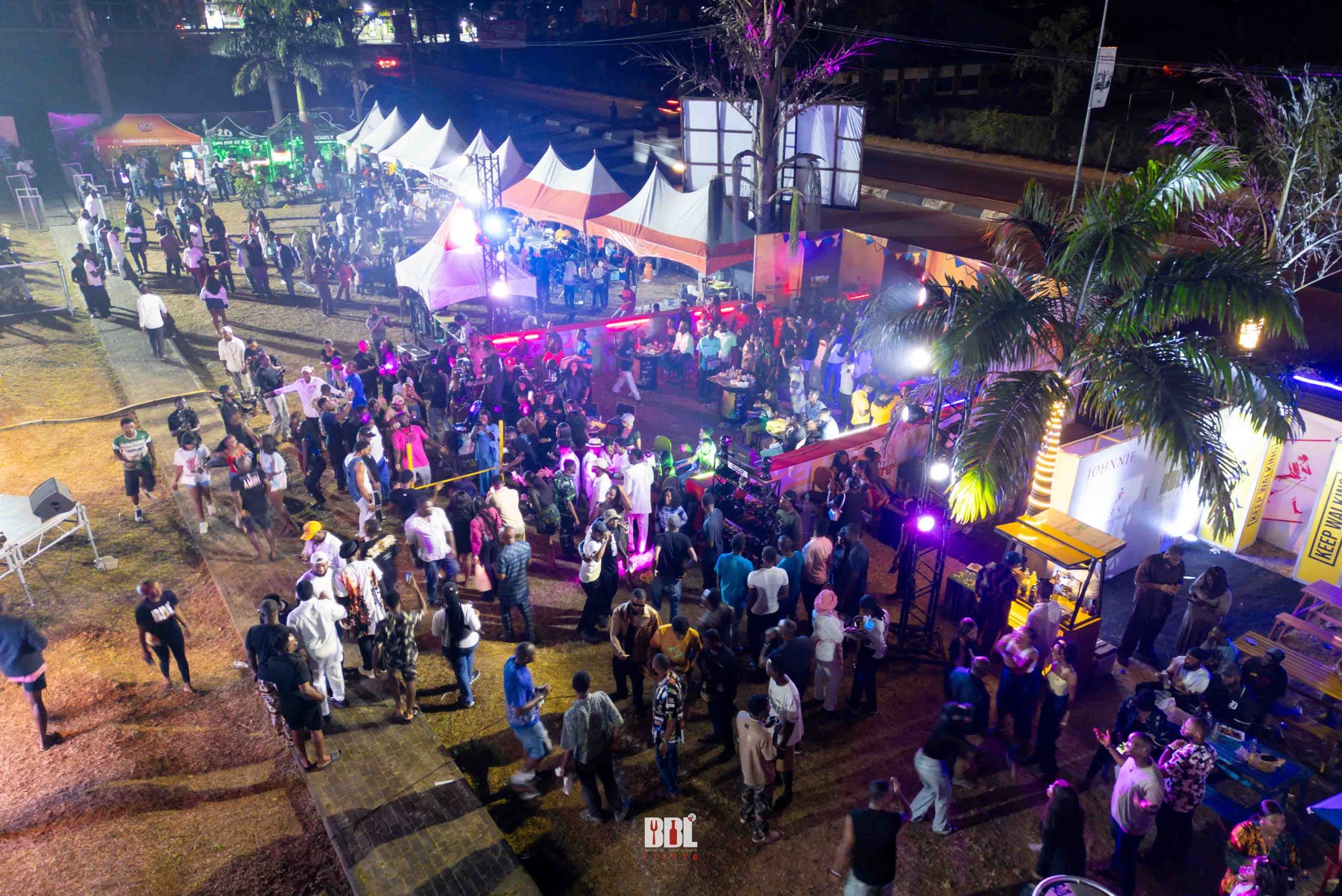 Aerial view of BBL Fiesta 2024 illuminated at night